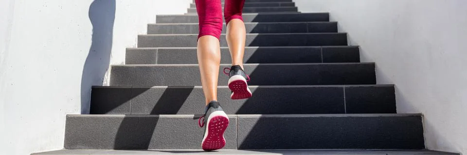 Hiit workout cardio running up the stairs training. Staircase climbing run woman Stock Photos