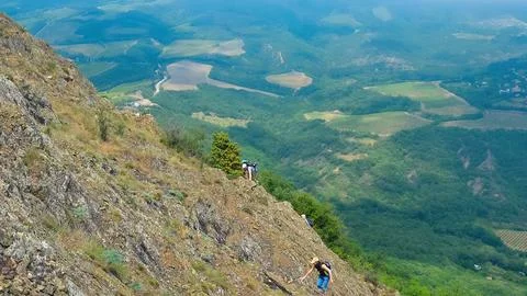 Hike on the peak of rocks mountain. Hiking in the mountains. Tourists with a Photos