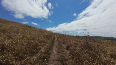 Hike up side of hill with dry grass Stock Footage 281025165