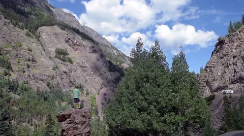 Hiker admires mountain view. Stock Footage 53373739