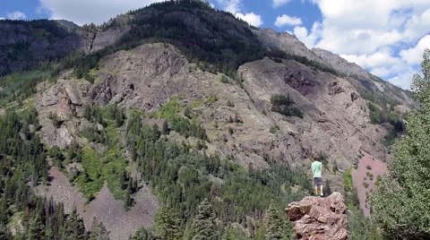 Hiker admires mountain view. Stock Footage 53373741