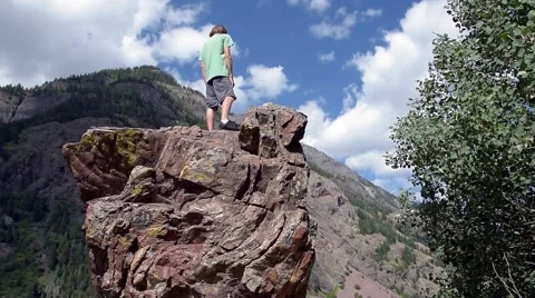 Hiker admires mountain view. Stock Footage 53373771