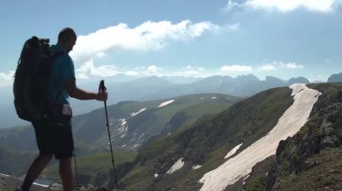 Hiker Advancing on a Mountain Path Handheld 4K Stock Footage 65291774