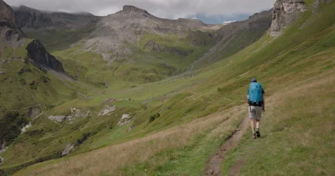 Hiker Approaching Mountain Hut Stock Footage 169933110