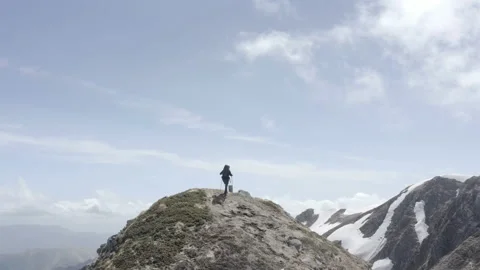 Hiker approaching the top of the mountain Stock Footage 222897455