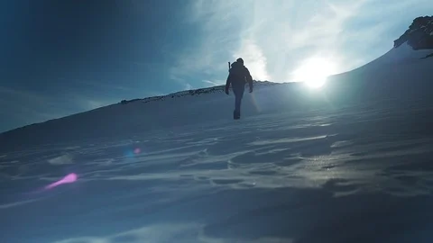 Hiker with backpack climbing top of mountain, mountaineering concept. Man Stock Footage 105027746