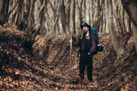 Hiker with backpack at forest Stock Photos