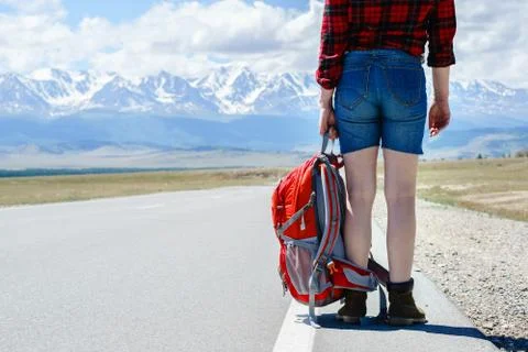 Hiker with backpack on the road before beginning. Stock Photos