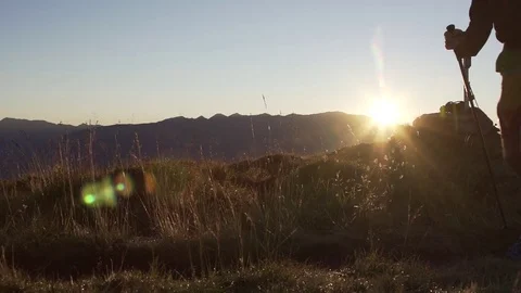 Hiker with backpack running up the hill Stock Footage 76003374