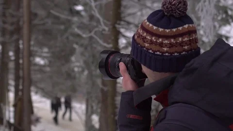 Hiker with backpack standing on top of a mountain and enjoying Stock Footage 73753956