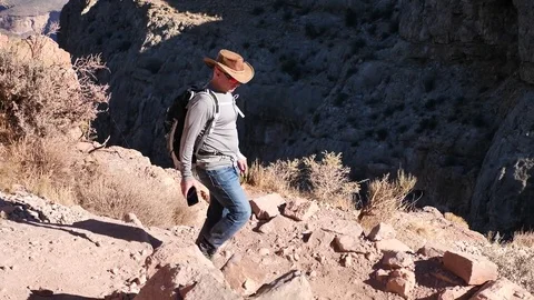 Hiker with backpack walk down the South Kaibab Trail Stock Footage 85438236