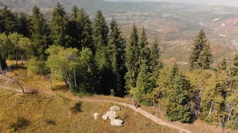 Hiker with backpack walking in the mountains Stockbeeldmateriaal 141198398