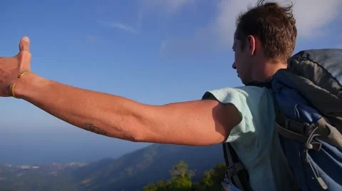 Hiker with Backpacker Standing on Top with Raised Hands Video stock 66549965