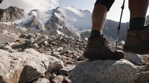 Hiker with big backpack in the mountains Stock Footage 243877232