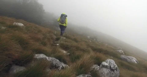 Hiker climbing on the mountain Stock Footage 82465354