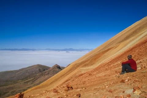 Hiker on colored mountain Stock Photos