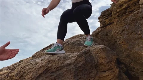 Hiker descends rocky surface. Movement and endurance concept Stock Footage 340242018