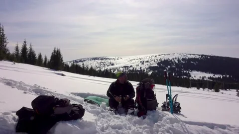 Hiker Drinking Cofee, Relaxing, Lying On Sleeping Pad In Winter Mountains Stock Footage 172111448