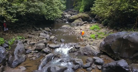 Hiker explore the Sekumpul Falls Stock Footage 96015022