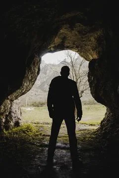 Hiker exploring cave Stock Photos