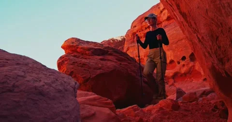 Hiker Exploring Red Rock Canyon with Trekking Poles Video stock 323799862
