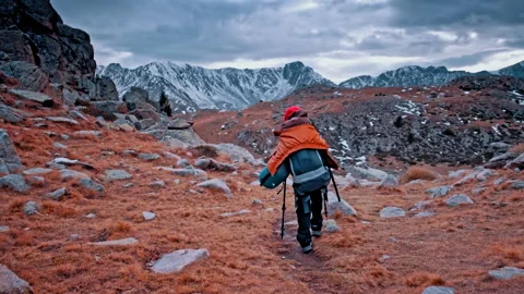 Hiker exploring the rugged trails of the Pyrenees mountains in Spain Stock Footage 303627779
