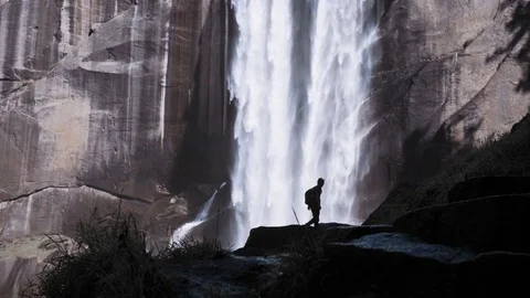 Hiker In Front Of Waterfall 4K Stock Footage 80574231