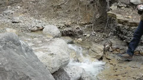 Hiker get water from a stream Stock-Footage 13150820
