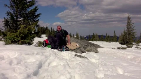 Hiker getting into sleeping bag after a day hike Stock Footage 152614874