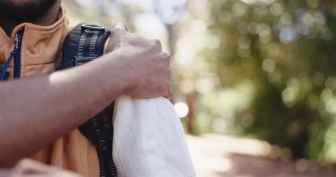 Hiker, hand and man in forest, shoulder pain and countryside with environment. Stock Footage 325834803