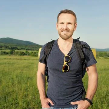 Hiker on the hillside. Stock Photos