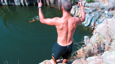Hiker jumping in pool 02 Stock Footage 89480649