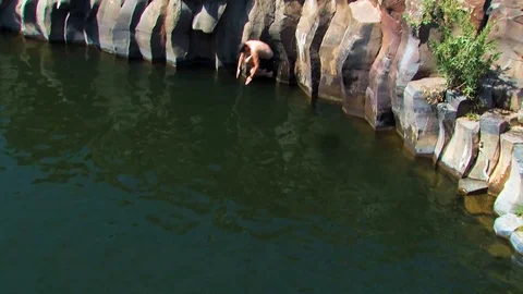 Hiker jumping in pool 03 Stock Footage 89480604