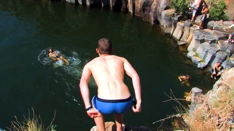 Hiker jumping in pool 04 Video stock 89480678