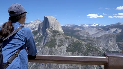 Hiker lean against railing with mountain Stock Footage 113195497