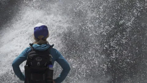A hiker looking at a waterfall Stock Footage 144786721