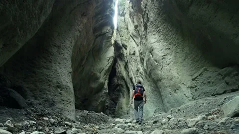 Hiker Man Exploring Dark Mysterious Cave. Stock Footage 90216756