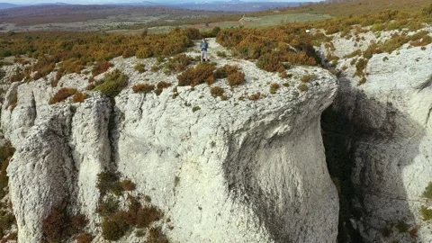 Hiker man in a rocky cliff. Stock Footage 178452701