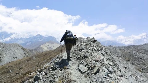 Hiker men walking on the mountain path Stock Footage 77450463