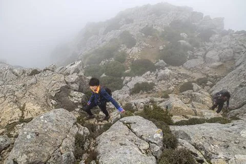 Hiker in the mist hiker in the mist, ascent path to Puig de Galatzó, Tramo.. Stock Photos