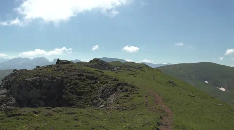 Hiker on a Mountain Path 4K Stock Footage 65291633