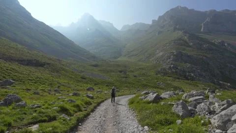 Hiker on a mountain path in Picos de Europa, Spain Stock Footage 341034416