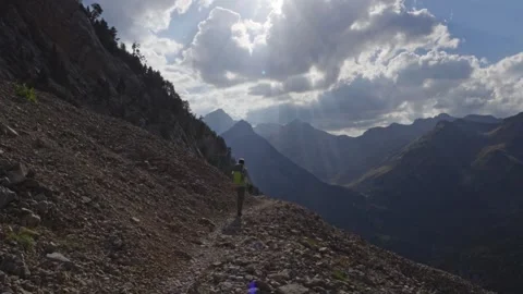 Hiker on a mountain path in the Pyrenees, Spain Stock Footage 341459360