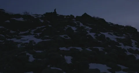 Hiker on the mountain top during winter 스톡 동영상 103809098