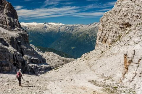Hiker on a mountain trail. Stock Photos