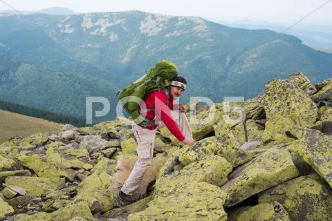 Hiker in mountains Stock Photos