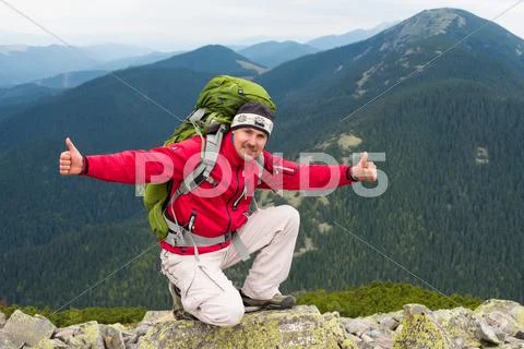 Hiker in mountains Stock Photos