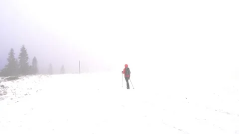 Hiker in the mountains in winter Video stock 168692764