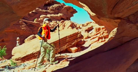 Hiker Navigating Red Rock Canyon Landscape Stock Footage 325217221