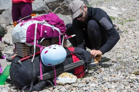 Hiker Packing Backpack Stock Photos